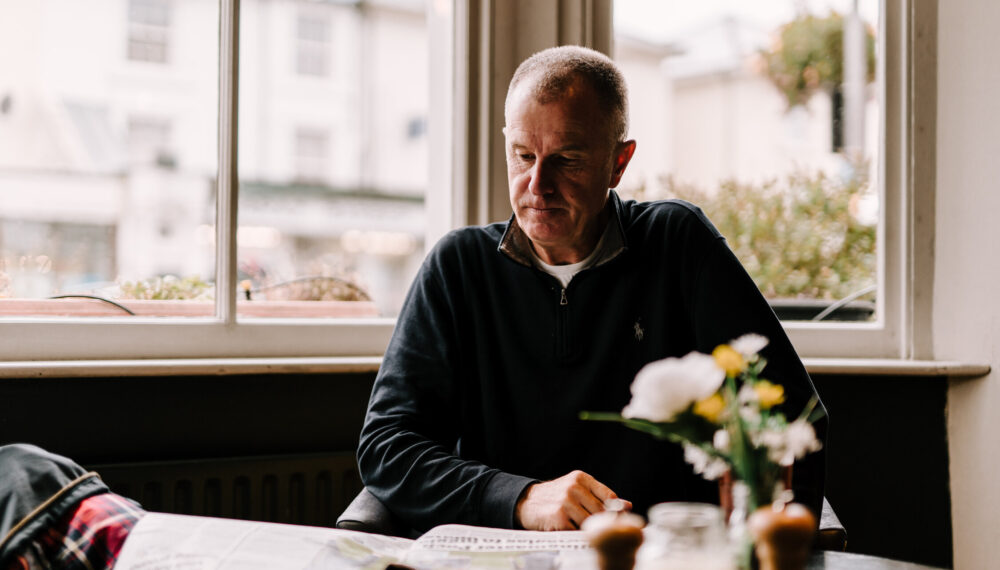 Person sitting reading in a pub