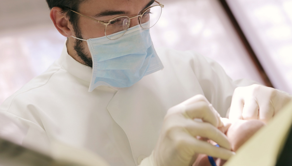 Dentist inspecting a patient.